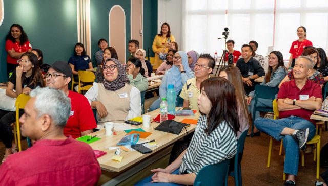 volunteer mentors smiling at Mentors Mid-Year Recharge