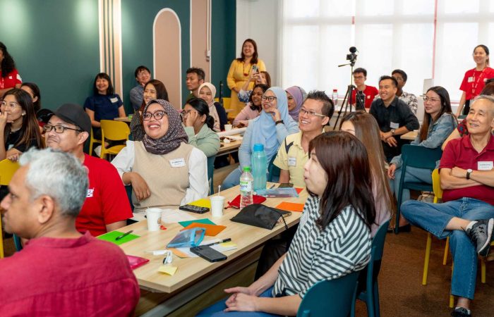 volunteer mentors smiling at Mentors Mid-Year Recharge